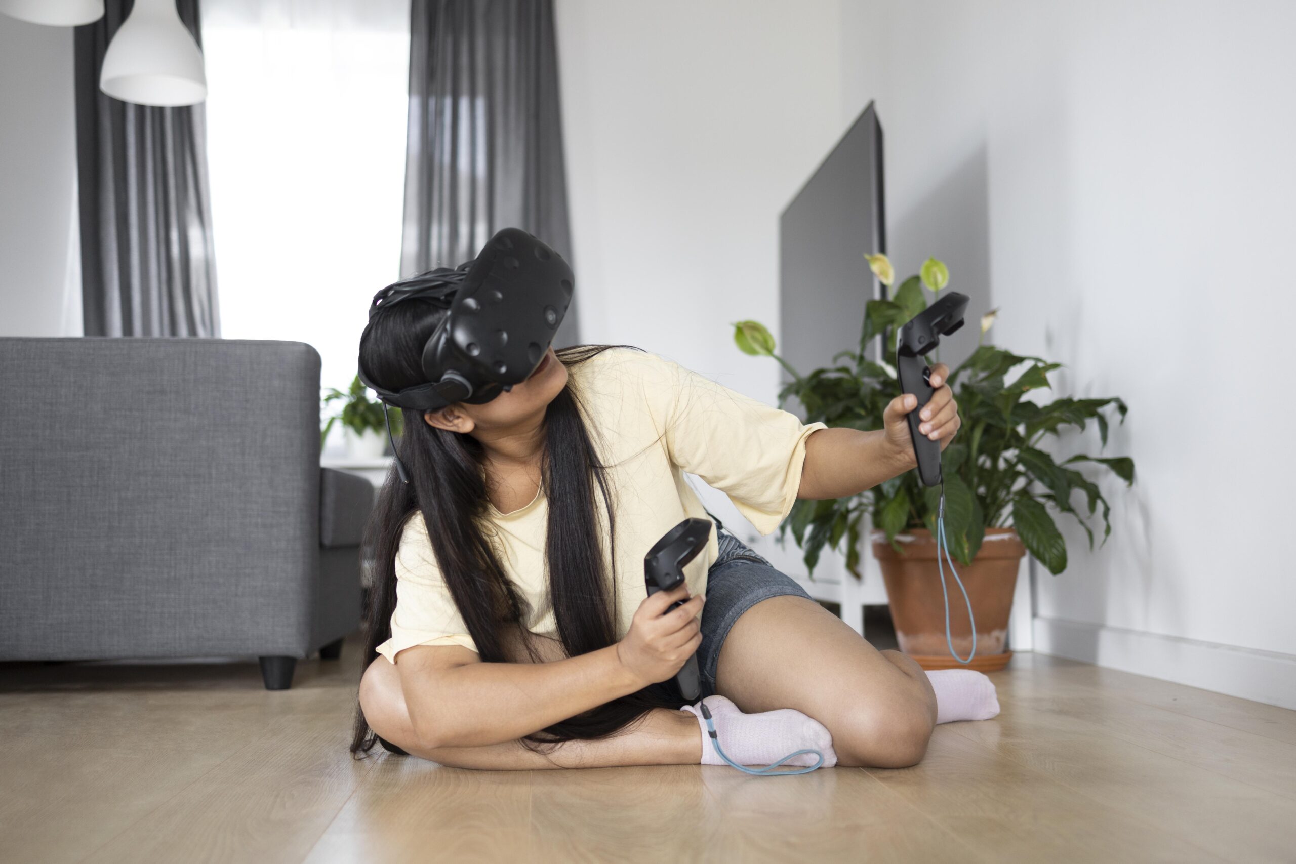 young-person-playing-videogames-with-vr-glasses